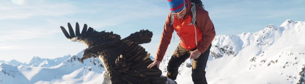 Artist Walter File with his sculpture in the Alps